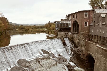 Overlooking Ottauquechee River Falls in the New England town of Quechee, Vermont on a cool, Fall dayの写真素材