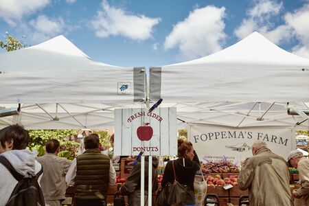 Boston, Massachusetts - October 3rd, 2019: People shopping for fresh produce and local goods at a farmers market in Copley Square on a Fall day.のeditorial素材