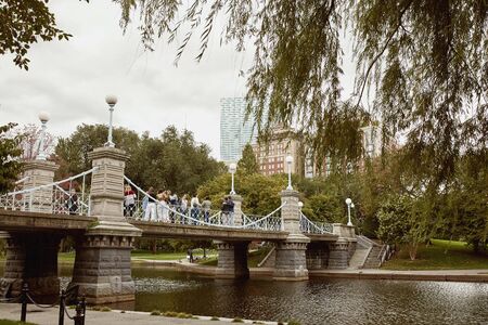 Boston, Massachusetts - October 3rd, 2019:  Lagoon Bridge overlooking pond at Boston Public Garden in the Back Bay neighborhood of Boston.のeditorial素材