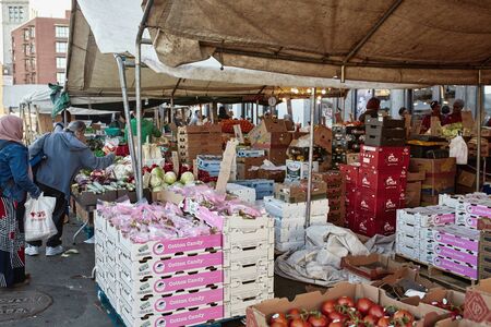 Boston, Massachusetts - October 3rd, 2019: People shopping for fresh produce at Boston's open air Haymarket in downtown Boston.のeditorial素材