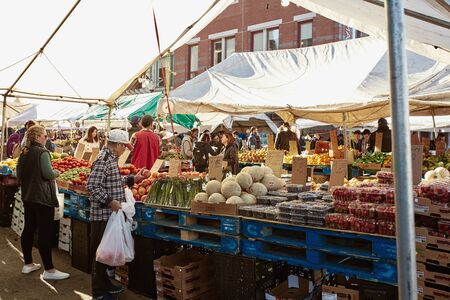 Boston, Massachusetts - October 3rd, 2019: People shopping for fresh produce at Boston's open air Haymarket in downtown Boston.のeditorial素材