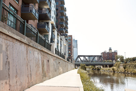 View down path of Cherry Creek Trail along Platte River.  Surrounded by apartments and condominiums in Downtown Denver.  Denver, Colorado, USAのeditorial素材