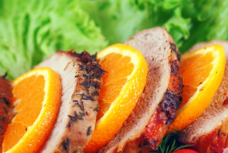 fresh juicy steak sliced, with orange peel and vegetableの写真素材