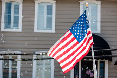 United States of America Passport on work desk with keyboard, coffee cup, mouse, computer, note pad. Travel, traveling.の写真素材