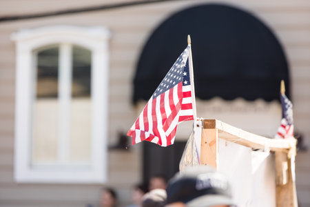 American Flag in front of a house in the United States of Americaの写真素材