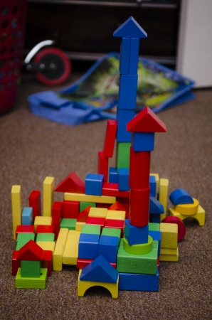 a child s go at engineering   building with coloured wooden blocksの写真素材