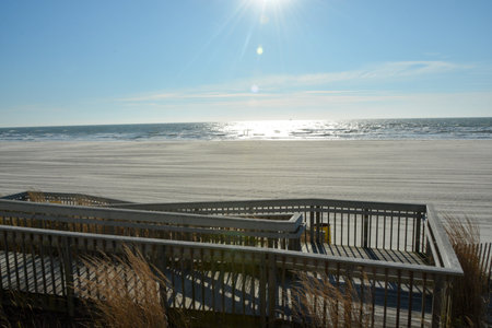 Wooden walkway on the beach in Atlantic City, NJ.  Sunny day.の写真素材