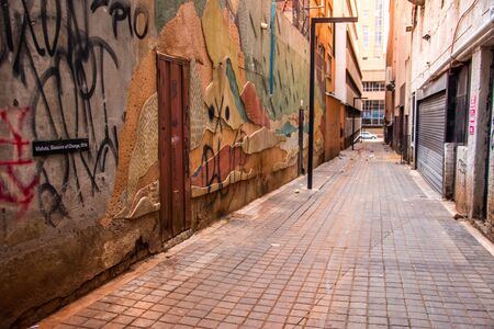 Johannesburg / South Africa - November 19 2016: View of an alleyway with street art and graffiti on the walls in the CBDのeditorial素材