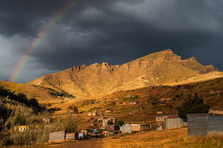 Rainbow over the mountains in the Lesotho village of Daliweの写真素材