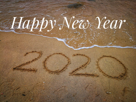 Text label with background of sandy beach, happy new year