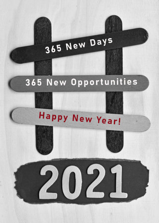 Text on black and white stick with year 2021background. Happy new year concept