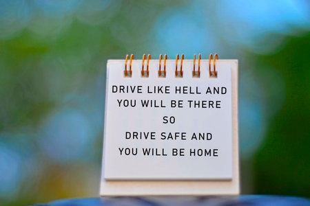 Text Written On A Notepad With Blurred Green Background. Road Traffic Concept