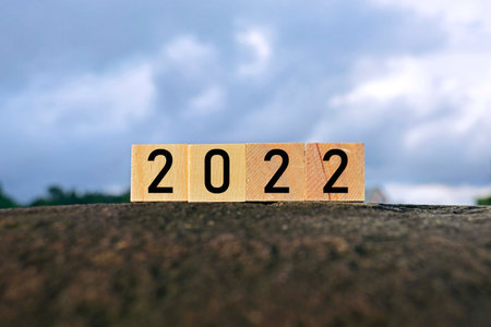 2022 number on wooden block on top of big stone - 2022 new year conceptの写真素材