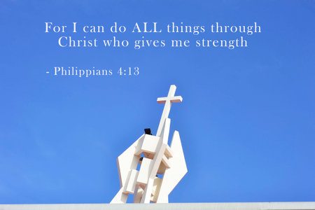 Inspirational verse from the bible on blue background with wooden white cross. Top view and sky backgroundの写真素材