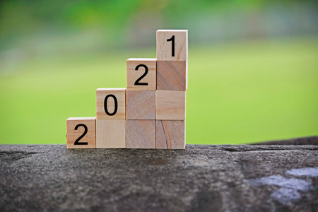 2021 number on wooden block with blurred background. 2021 new year conceptの写真素材