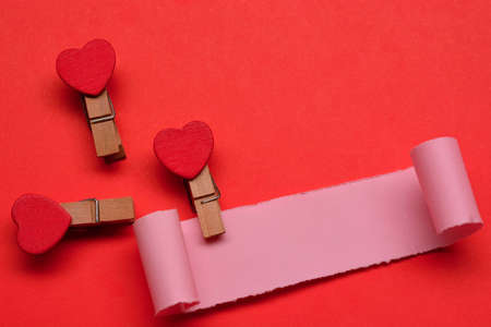 Torn paper with red paper background. Valentine's Day concept. Blank for text useの写真素材