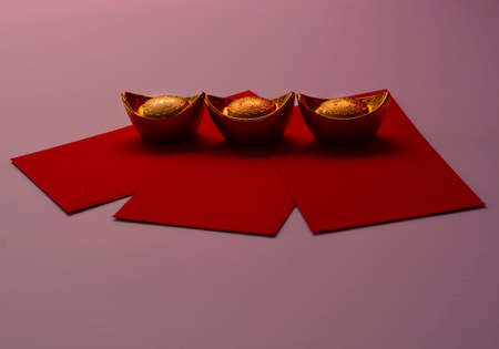 Chinese New Year Spring festival decorations pow or red packet and gold ingots or golden lump on a pink backgroundの写真素材