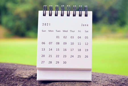 June 2021 white calendar with green blurred background. 2021 new year concept.の写真素材