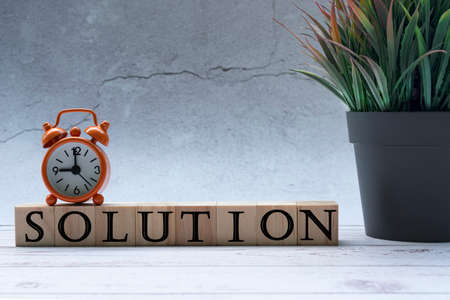 Text on wood block with alarm clock on topの写真素材