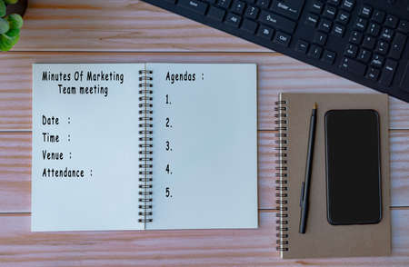 Meeting minutes list text written on notepadの写真素材