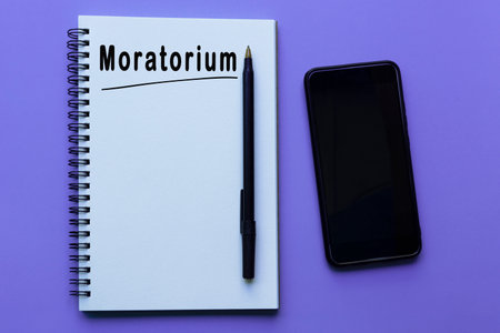 Moratorium text on notepad on purple backgroundの写真素材