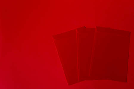 Chinese New Year Concept - Red packets on red backgroundの写真素材