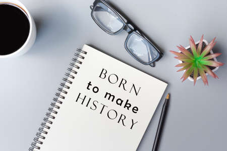 Motivational and inspirational quote on notepad - Born to make historyの写真素材