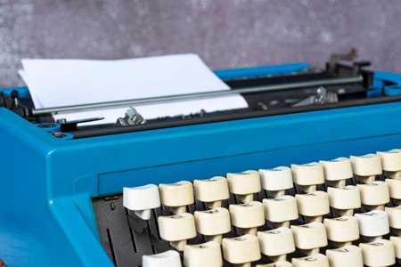 An old classic typewriter on wooden desk. Copy space. For text purpose. Background.