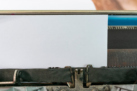 An old classic typewriter on wooden desk. Copy space. For text purpose. Background.の写真素材