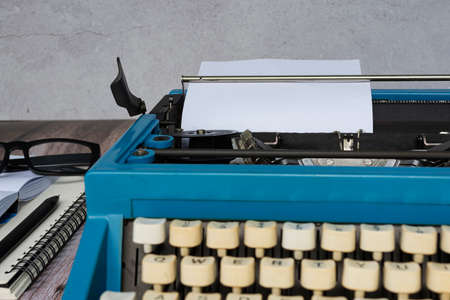 An old classic typewriter on wooden desk. Copy space. For text purpose. Background.の写真素材