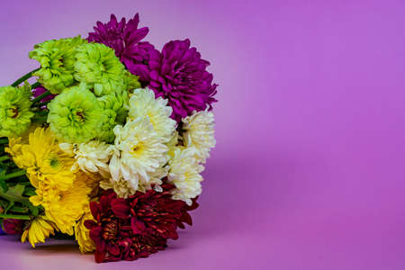Design concept of Mother's day holiday greeting design with flower bouquet on purple background. Copy space.の写真素材