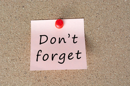 Sticky note with word dont forget. Reminder and appointment concept.