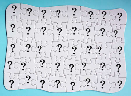 Set of 40 puzzle pieces with question mark isolated on blue background. Directly above.の写真素材