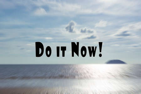 Motivational and inspirational quote on blurry sunset beach with zoom motion effect background - Do it Now.の写真素材