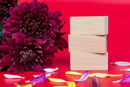 Design concept of Mother's day holiday greeting design with flower bouquet and wooden cube. Copy...