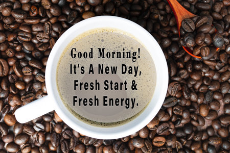 Motivational quote on cup of coffee on coffee beans background - Good morning, it is a new day, fresh start and fresh energy.の写真素材