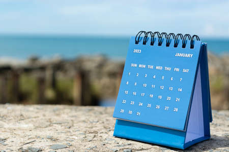 Blue January 2023 calendar on blurred background of blue ocean. 2023 New Year Conceptの写真素材