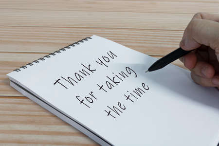 Hand writing thank you for taking the time text on notepad. Recognition and enjoyment of the good qualities of someone.の写真素材