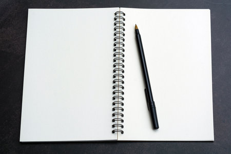 Directly above view of office desk table with pen and notepad. Flat lay. Copy space.の写真素材