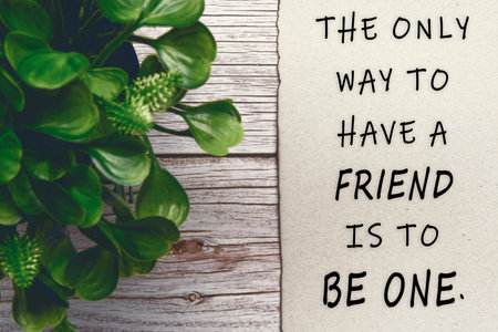 Motivational and inspirational quote on burnt edge brown paper on wooden desk - The only way to have...