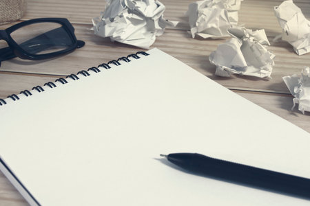 Notepad with trash paper background on office desk. Copy space.の写真素材
