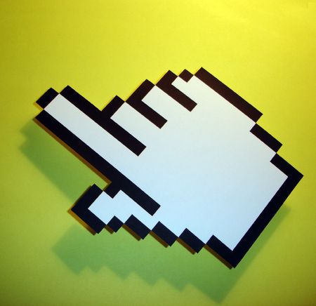 hand cursor on a green backgroundの写真素材