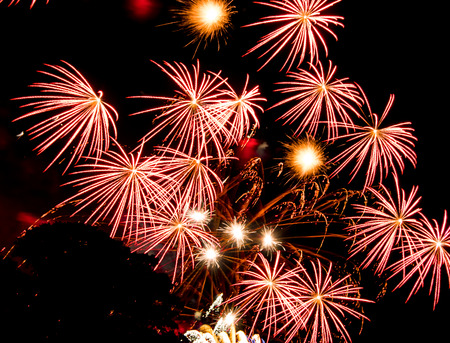 Red star bursts. Spectacular fireworks  at a national fireworks championship in its ninth year. Three of the UK best firework companies compete with a 10-minute firework display.の写真素材