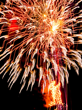 Large Golden burst sparkles.Spectacular fireworks  at a national fireworks championship. Three of the UK best firework companies compete with a 10-minute firework display.の写真素材