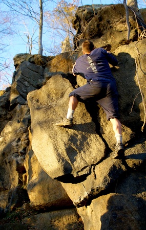 man climbs rockの写真素材