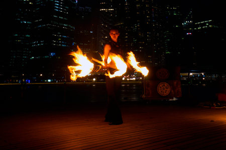 SINGAPORE - MAR 9  Fire Dancers street performance at Marina Bay on Mar 9, 2014 in Singapore 