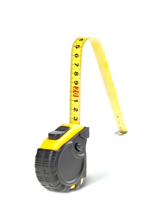 Yellow tape measure isolated on white backgroundの写真素材