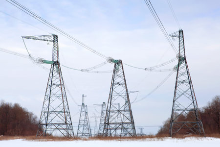 High-voltage columns against the sky