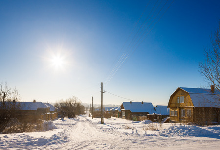 village street in winter at sunsetの写真素材