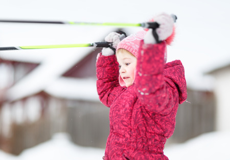 child engaged in skiing in the winterの写真素材